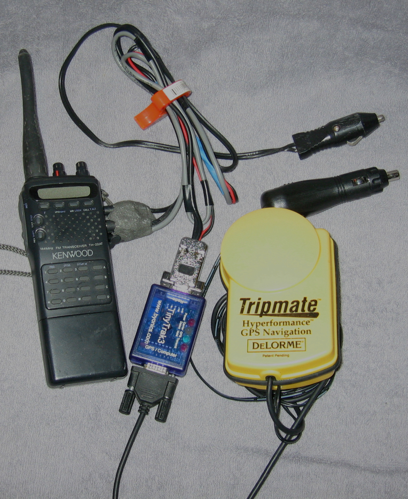 Picture of my first APRS rig, a Kenwood TH-22AT, Byonics TinyTrak3, and a DeLorme GPS